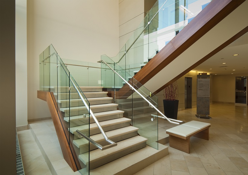 Modern glass and mahogany staircase